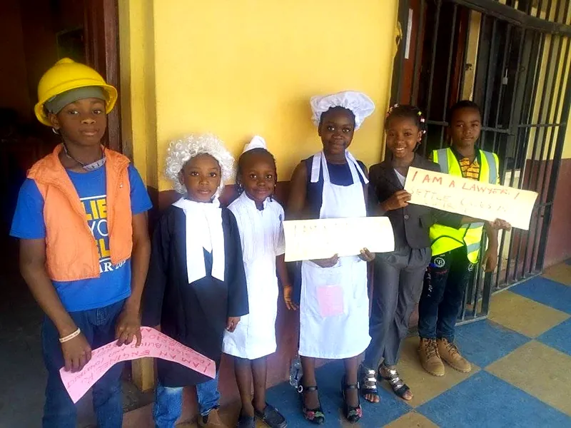 Pupils dressed for Career Day as a builder, a baker and a nurse