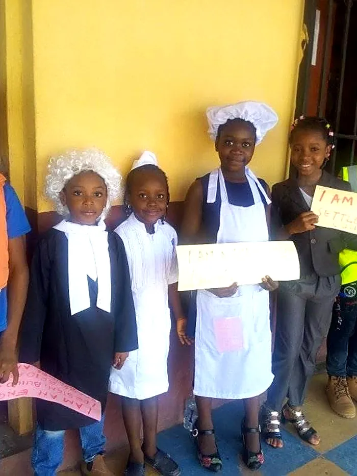 Pupils dressed as a builder, a baker and a nurse on Career Day