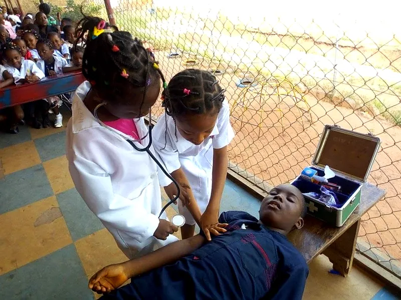 Two pupils playing doctor and patient during Career Day
