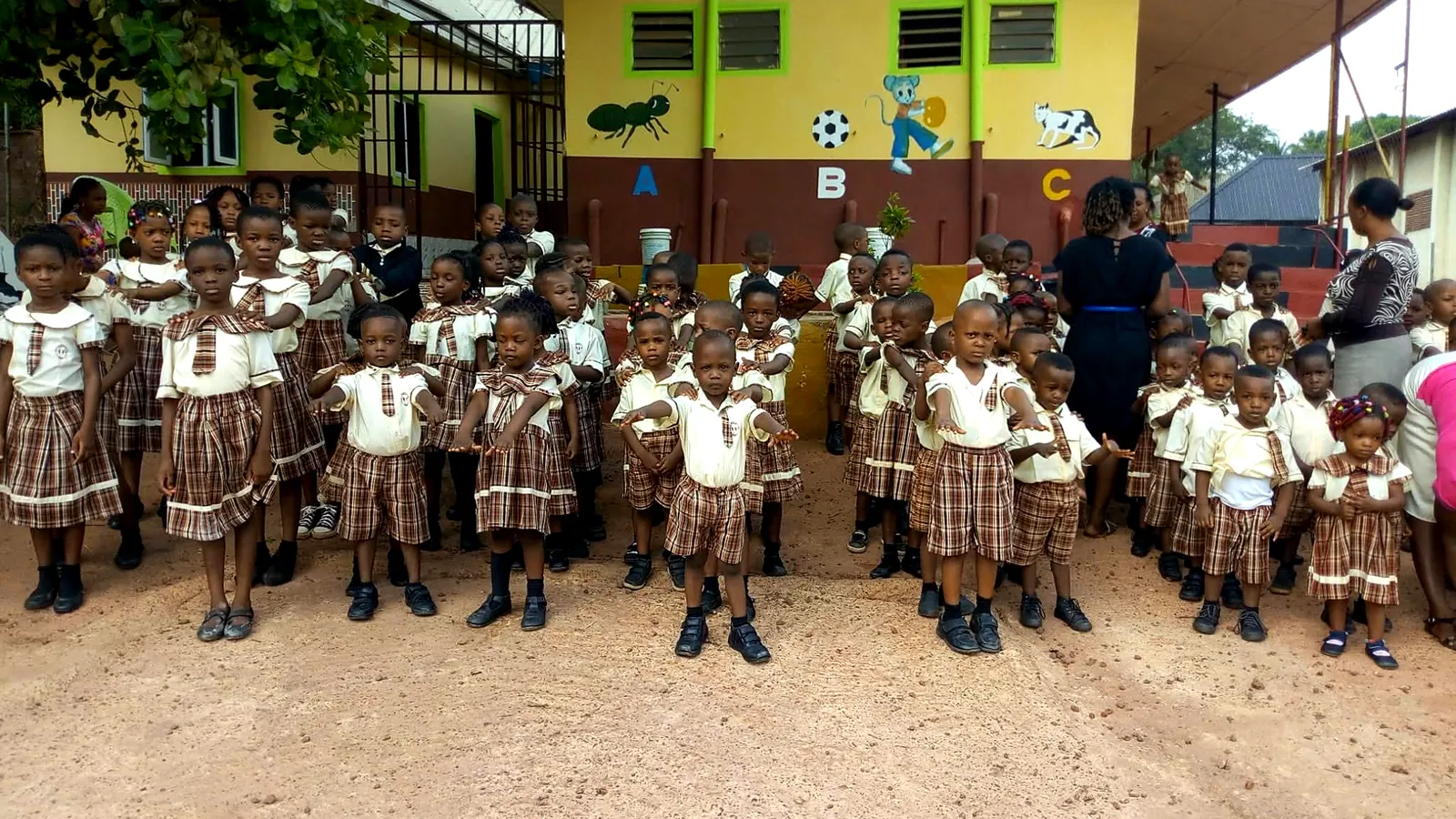 Pupils gathered in the school compound in front of the nursery block