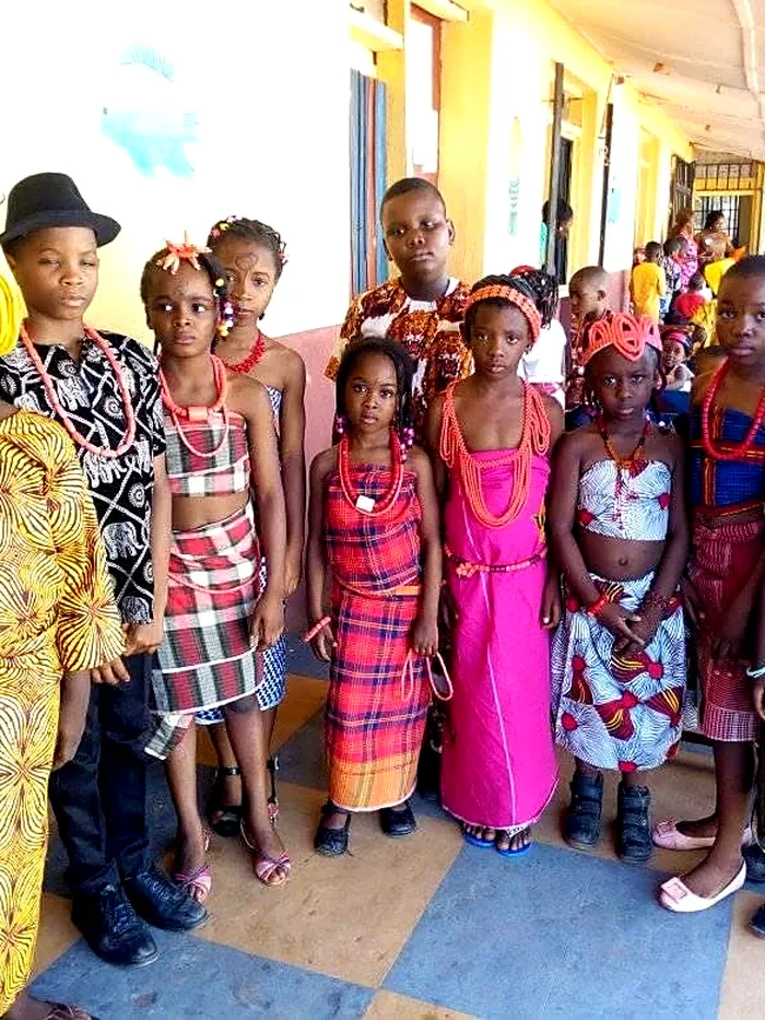 Pupils in traditional dress along the school corridor on Cultural Day